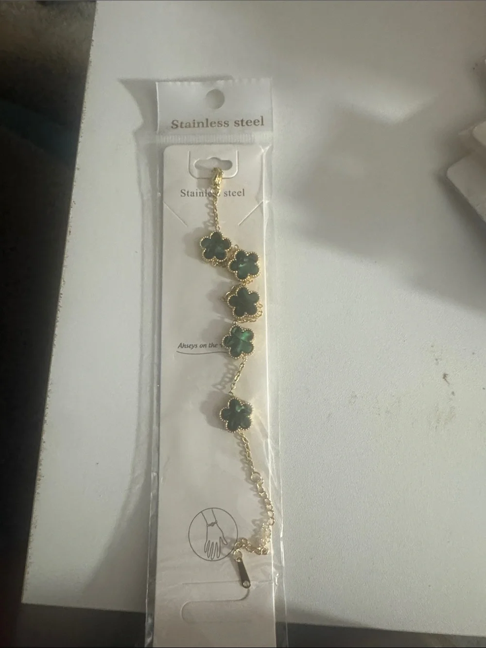 Gold Stainless Steel Bracelet with Green Clover Accents